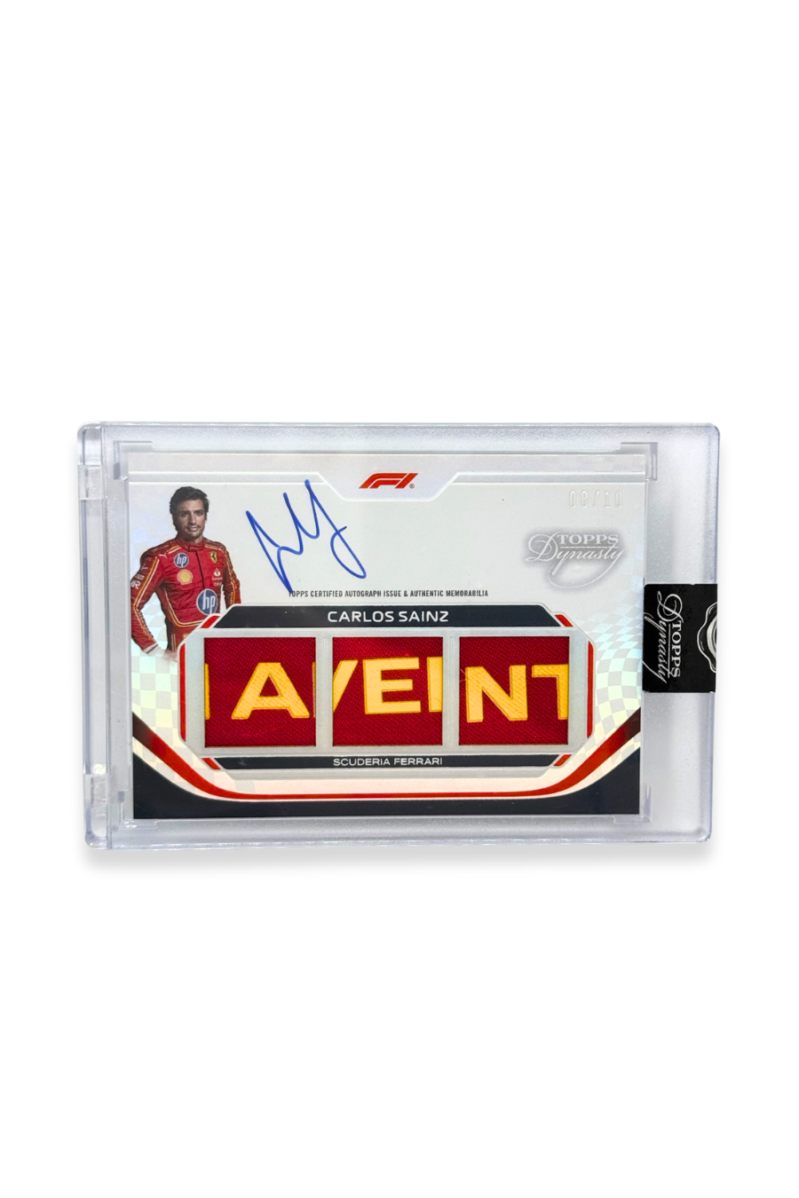 Front of 2024 Topps Dynasty Carlos Sainz triple patch F1 autograph card, serial numbered 8 of 10, showing red memorabilia patches with yellow lettering.