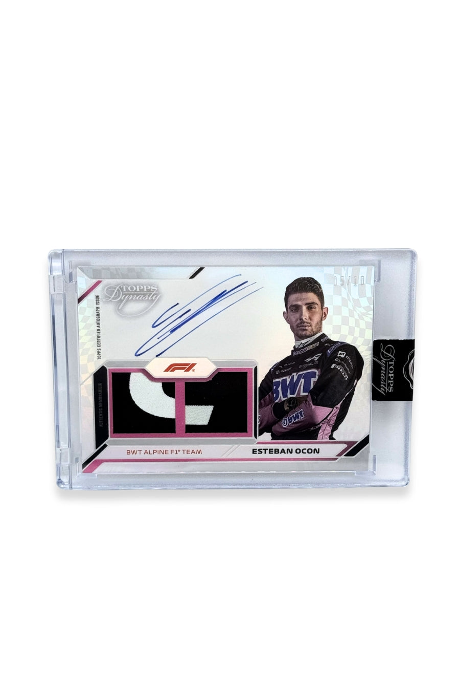 Front of 2024 Topps Dynasty Esteban Ocon double patch autograph card, serial numbered 5 of 10, showing black and white memorabilia patches.