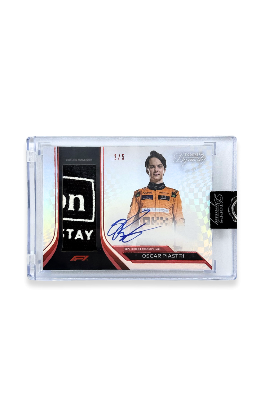 Front of 2024 Topps Dynasty Oscar Piastri patch autograph card, serial numbered 2 of 5, showing Hilton “For The Stay” logo memorabilia patch.