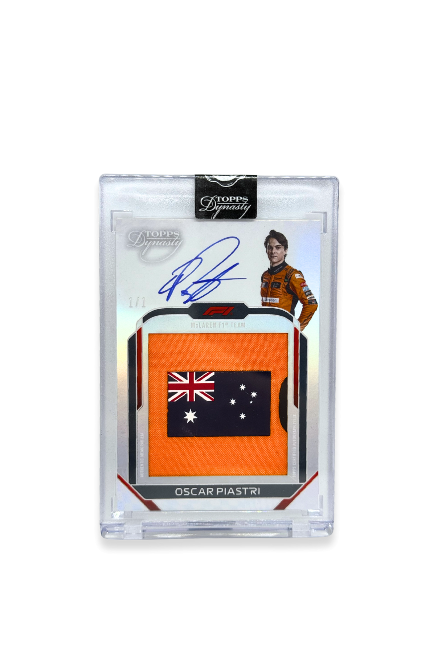 Front of 2024 Topps Dynasty Oscar Piastri jumbo Australian flag patch autograph card, serial numbered 1 of 1, showing Australian flag patch on orange background.