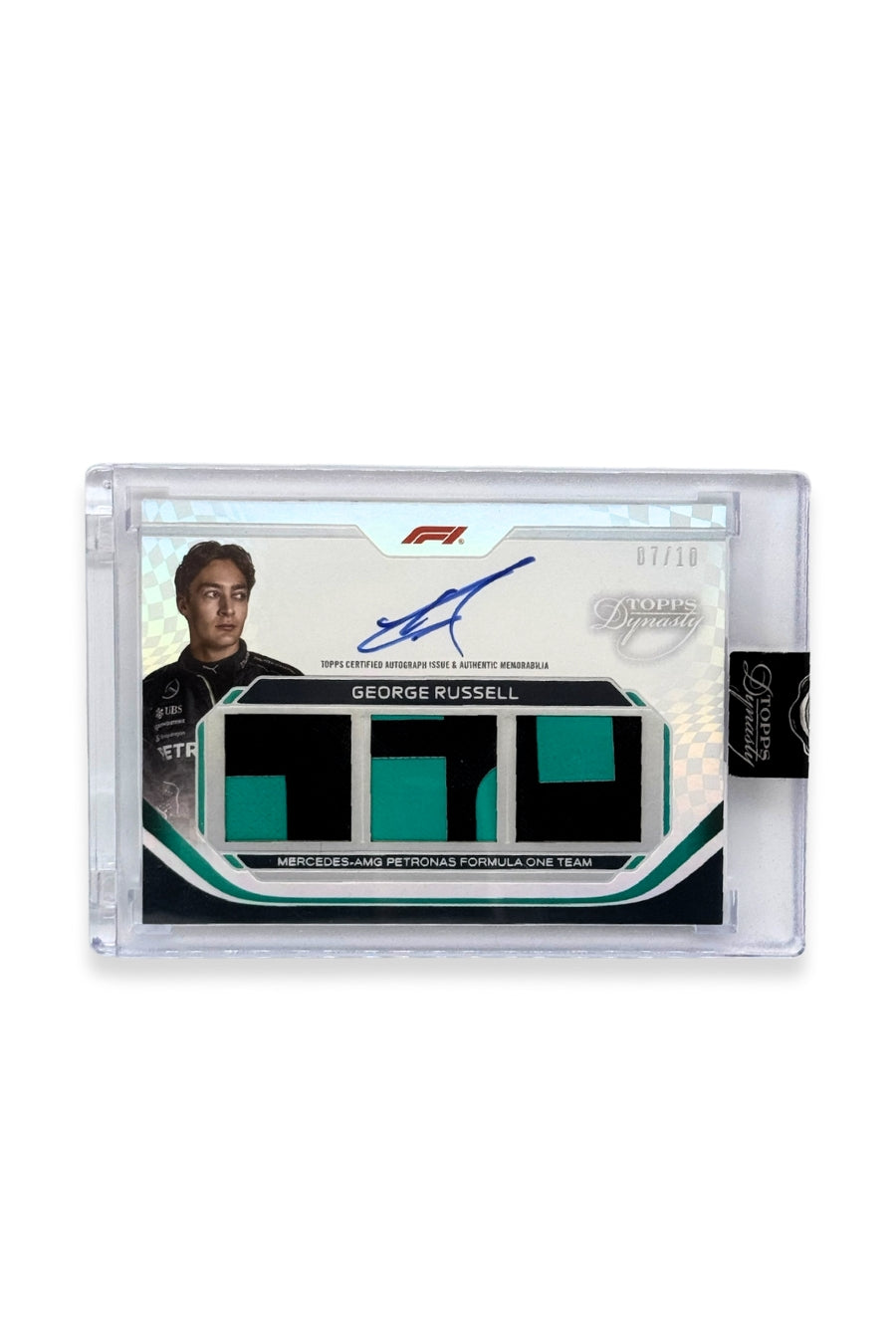 2024 Topps Dynasty George Russell Triple Patch Auto card #7/10 featuring three emerald green and black patches and an on-card autograph.