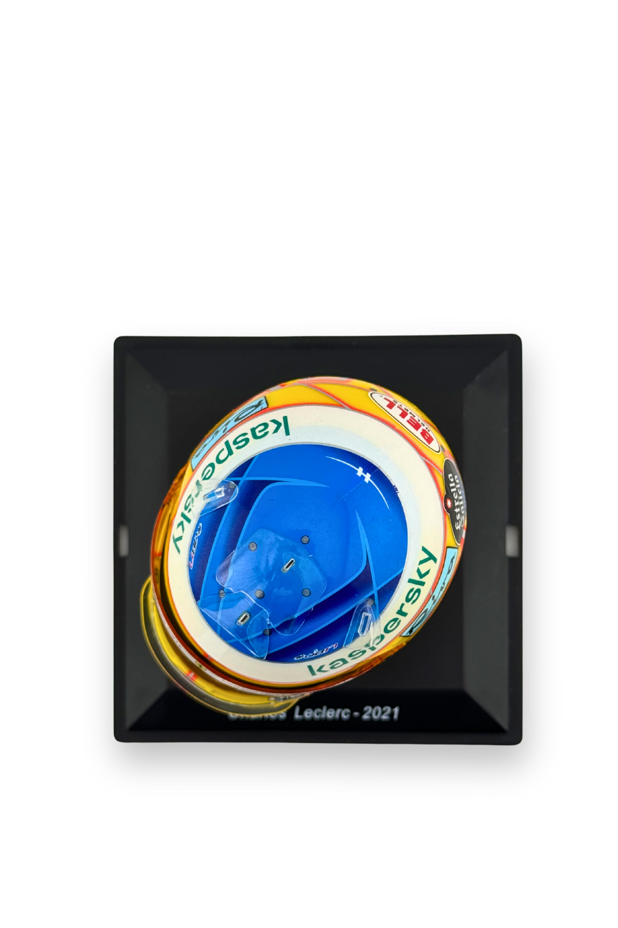 Top view of Charles Leclerc 2021 French GP Ferrari helmet with blue crown and Kaspersky sponsor branding.