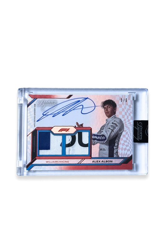 Front of 2024 Topps Dynasty Alex Albon double patch autograph card, serial numbered 3 of 5, showing two letter-style memorabilia patches in blue, white, and black.