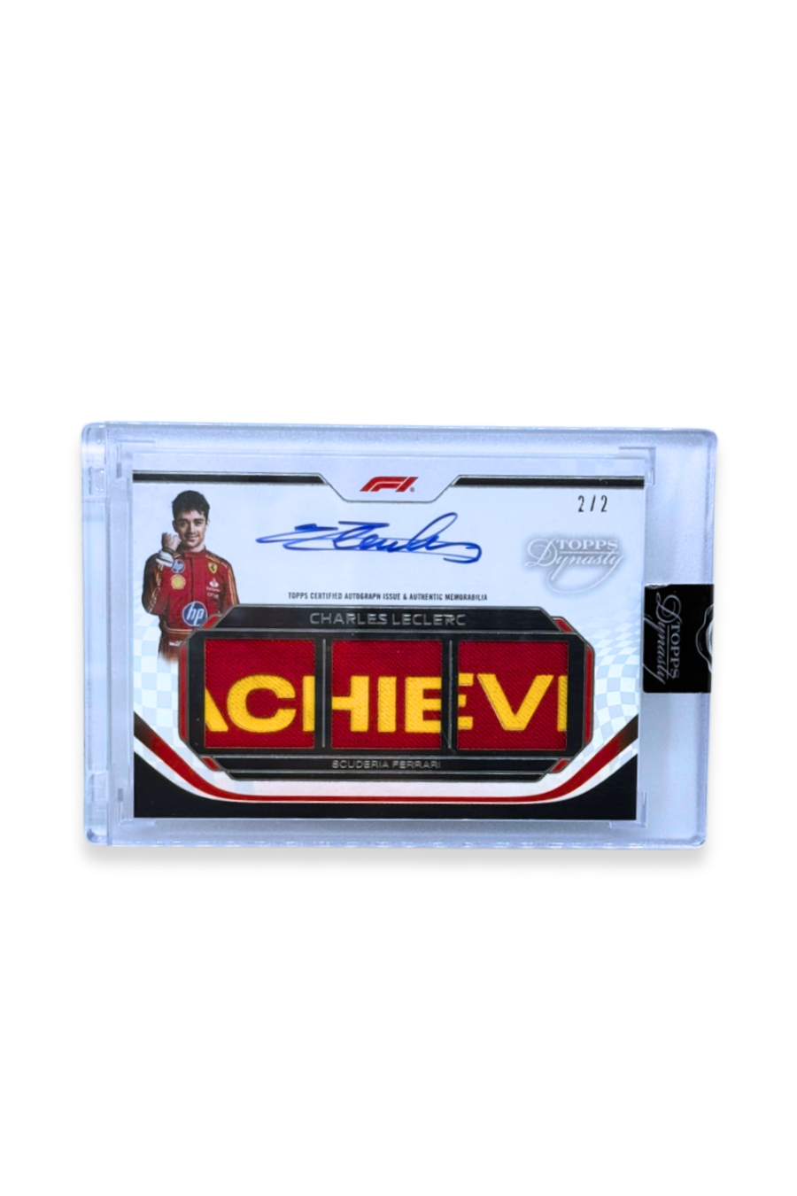Front of 2024 Topps Dynasty Charles Leclerc triple patch autograph card, serial numbered 2 of 2, showing Ferrari lettering memorabilia patch and autograph.