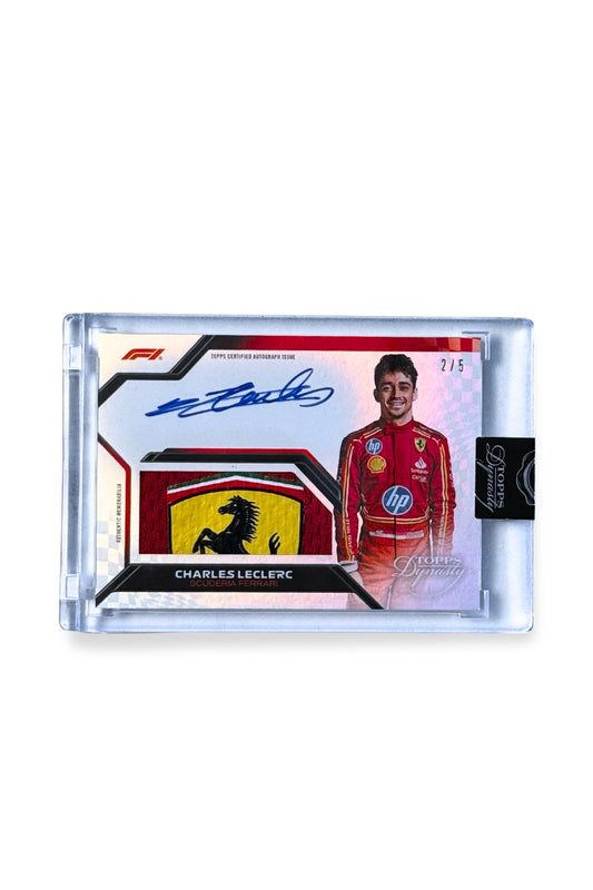 Front of 2024 Topps Dynasty Charles Leclerc patch autograph card, serial numbered 2 of 5, showing Ferrari prancing horse logo patch in yellow, red, and black.
