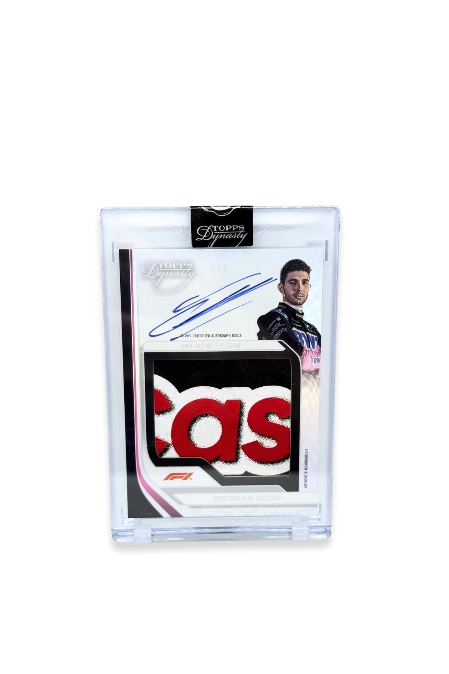 Front of 2024 Topps Dynasty Esteban Ocon jumbo patch autograph card, serial numbered 3 of 5, with red, white, and black sponsor logo patch.