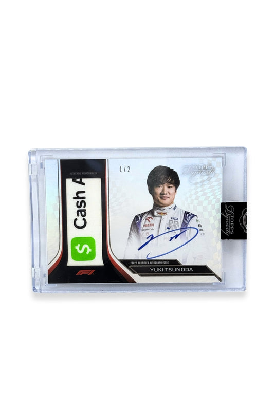Front of 2024 Topps Dynasty Yuki Tsunoda patch autograph card, serial numbered 1 of 2, featuring a white and green authentic memorabilia logo patch with Cash App branding from Visa Cash App RB Formula One Team.