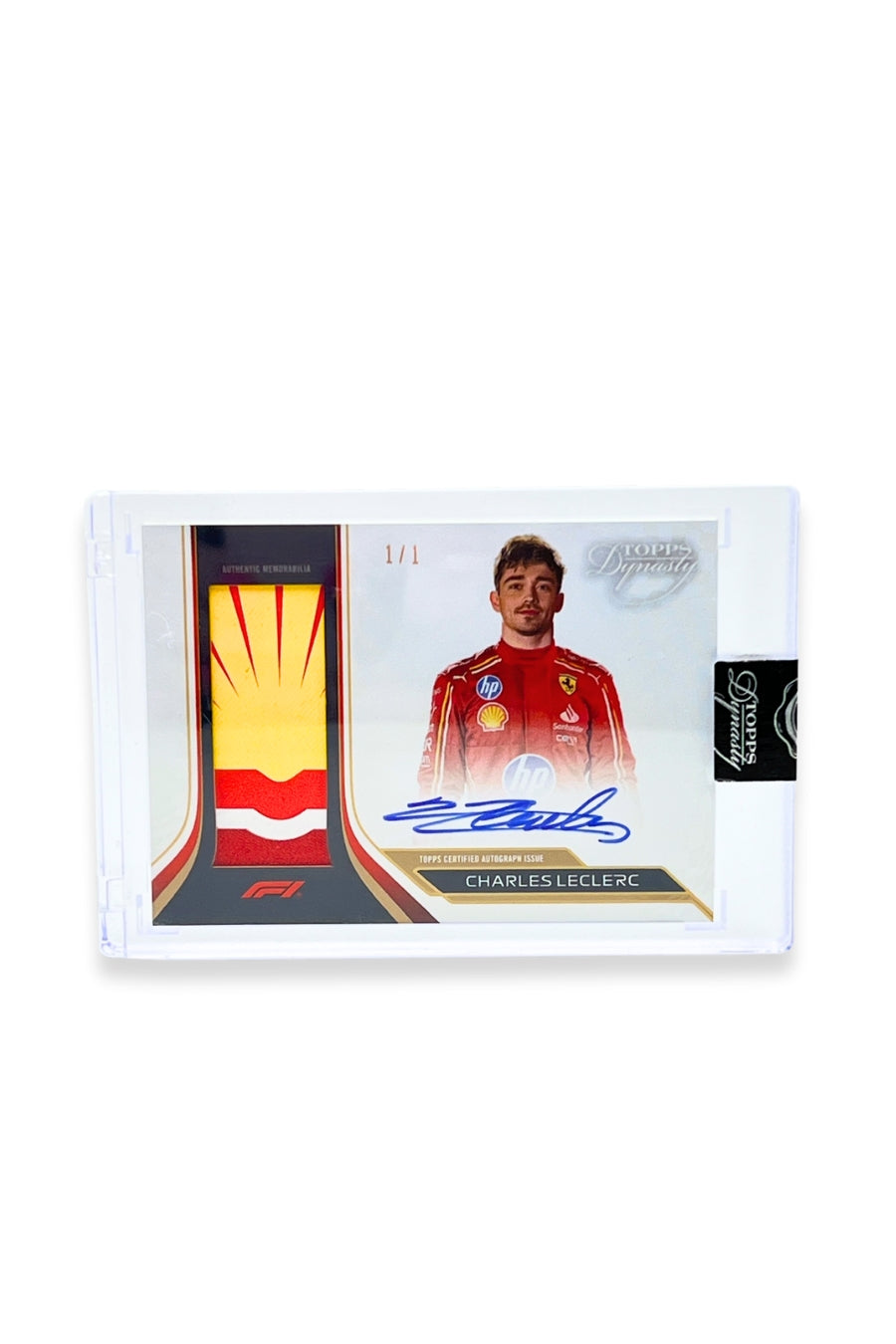 Front of 2024 Topps Dynasty Charles Leclerc Shell logo patch autograph card, serial numbered 1 of 1, showing red and yellow memorabilia patch.