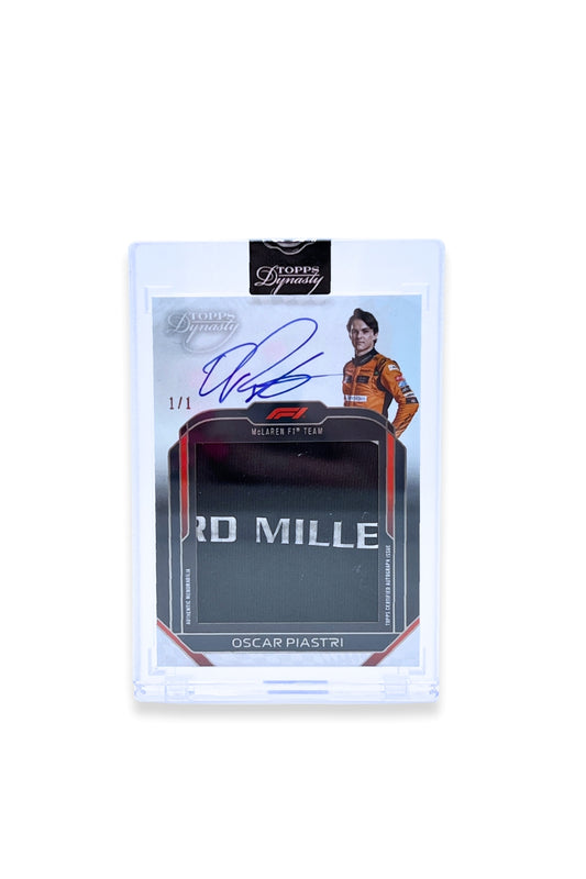 Front of 2024 Topps Dynasty Oscar Piastri jumbo Richard Mille logo patch autograph card, serial numbered 1 of 1, featuring black and silver patch.