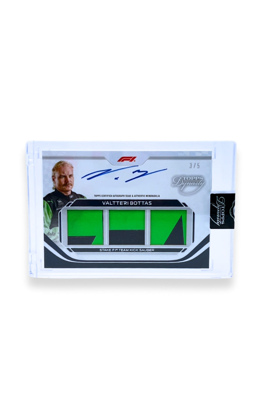 Front of 2024 Topps Dynasty Valtteri Bottas triple patch autograph card, serial numbered 3 of 5, featuring bright green authentic memorabilia patches with black accents from Stake F1 Team Kick Sauber.