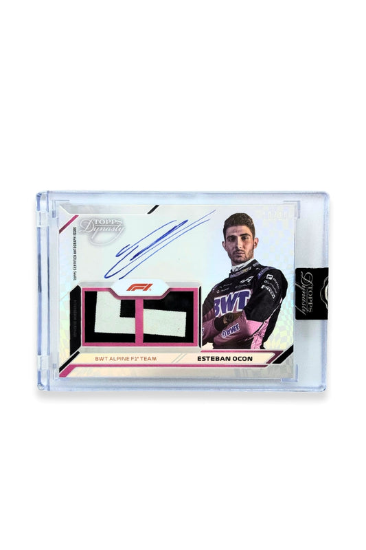 Front of 2024 Topps Dynasty Esteban Ocon double patch autograph card, serial numbered 10 of 10, featuring black and white authentic memorabilia patches from BWT Alpine F1 Team.