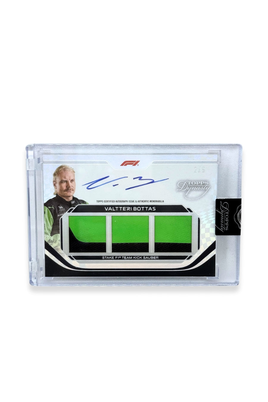 Front of 2024 Topps Dynasty Valtteri Bottas triple patch autograph card, serial numbered 2 of 5, featuring three bright green authentic memorabilia patches from Stake F1 Team Kick Sauber.