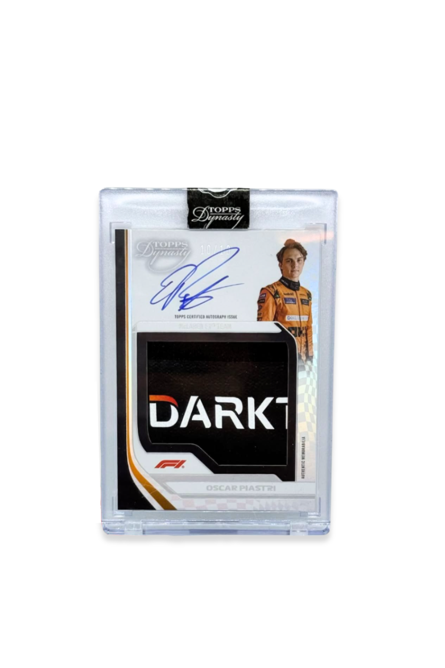 Front of 2024 Topps Dynasty Oscar Piastri patch autograph card, serial numbered 10 of 10, showing memorabilia logo patch with “DARKT” lettering.