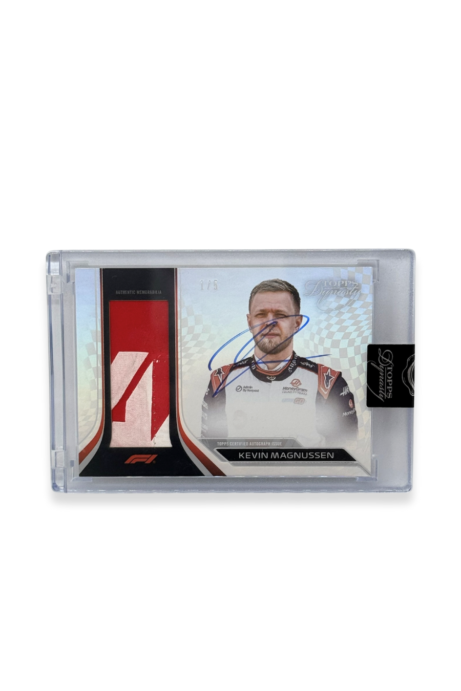 Front of 2024 Topps Dynasty Kevin Magnussen patch autograph card, serial numbered 1 of 5, showing red-and-white memorabilia patch with on-card autograph.