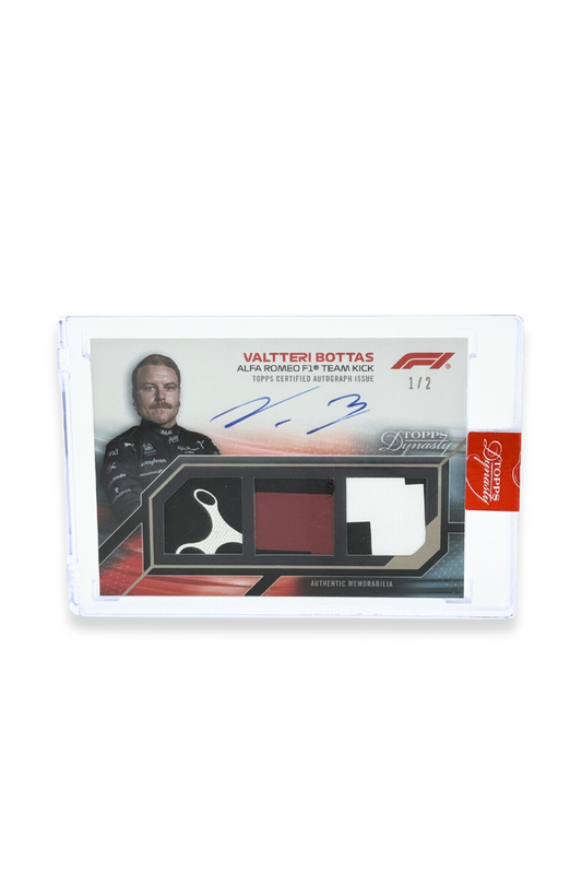 Front of 2023 Topps Dynasty Valtteri Bottas triple patch autograph card, serial numbered 1 of 2, featuring black, red, and white memorabilia patches.