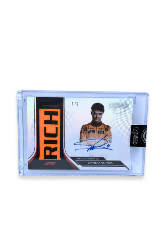 Front of 2024 Topps Dynasty Lando Norris Nameplate Patch Auto card, serial numbered #1/2, featuring a large orange "RICH" patch and autograph