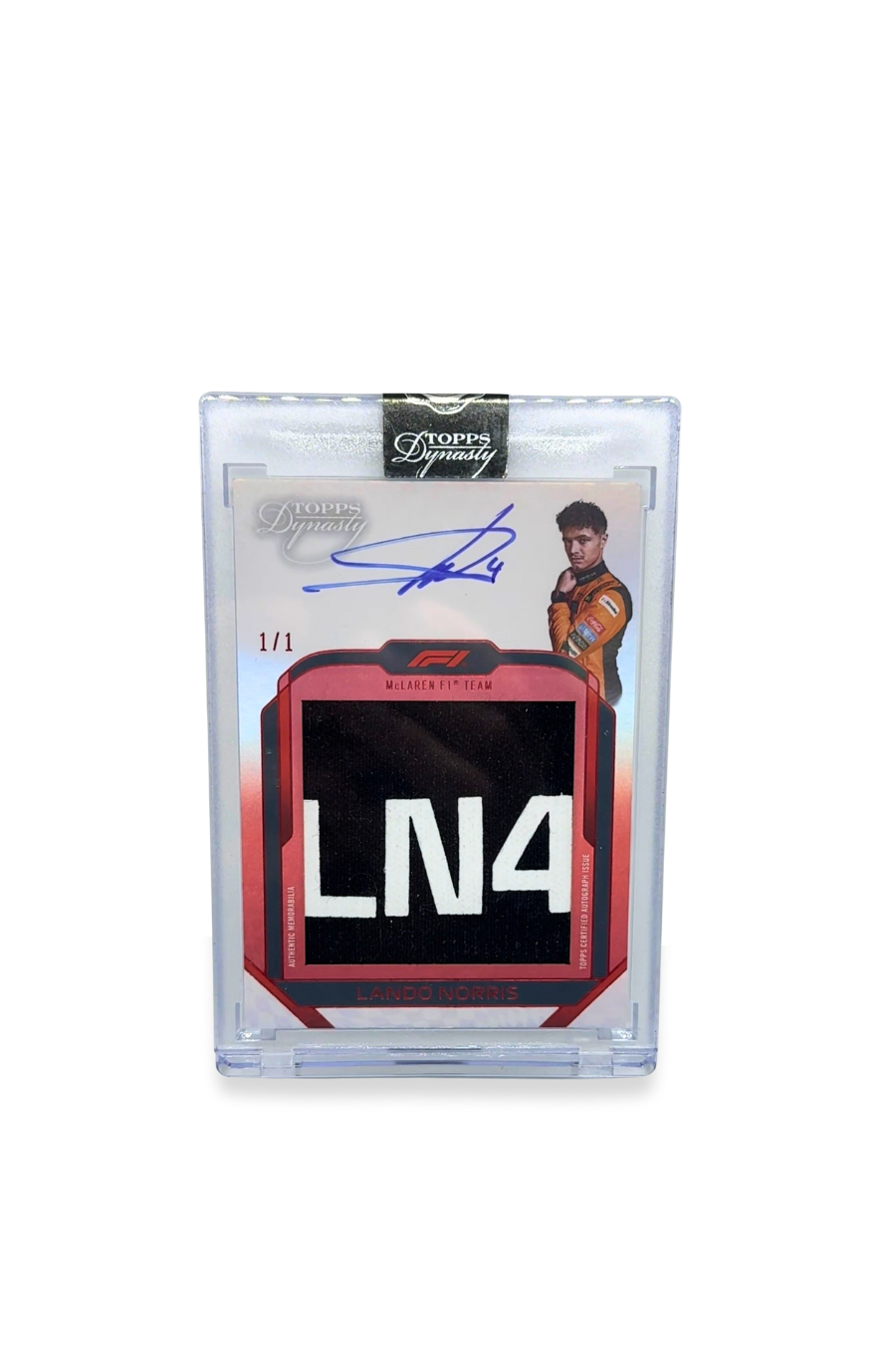 Front of 2024 Topps Dynasty Lando Norris nameplate patch autograph card, serial numbered 1 of 1, featuring the full white “LN4” patch on black.