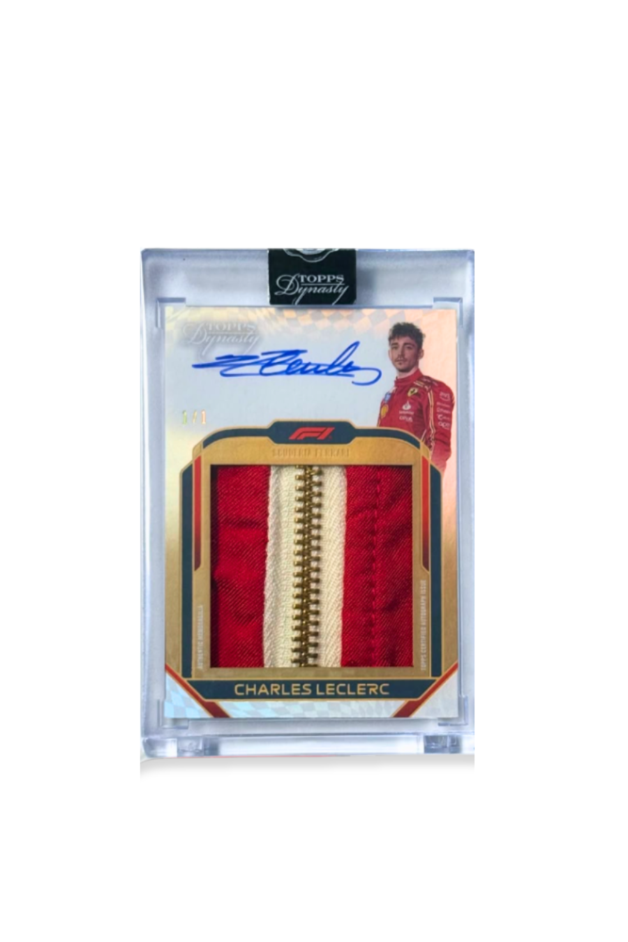 Front of 2024 Topps Dynasty Charles Leclerc autograph card, serial numbered 1 of 1, with a red and cream memorabilia patch featuring a gold zipper.