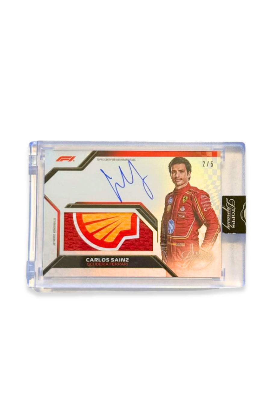 Front of 2024 Topps Dynasty Carlos Sainz autograph card, serial numbered 2 of 5, featuring full Shell logo memorabilia patch and on-card signature.