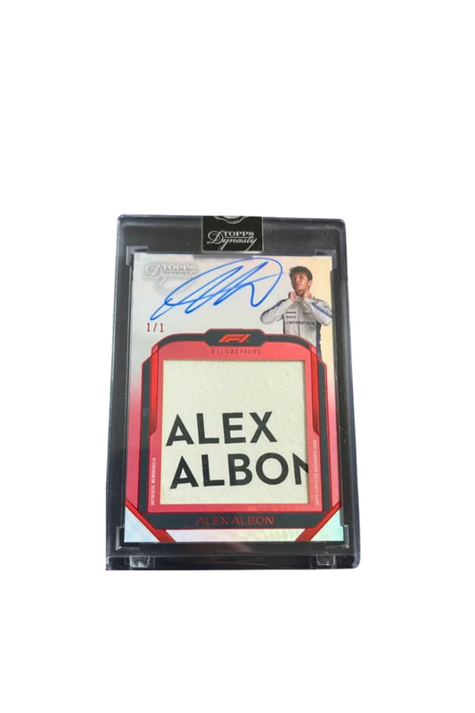 Front of 2024 Topps Dynasty Alex Albon Name Patch Auto card, serial numbered 1 of 1, showing full name patch and on-card signature.