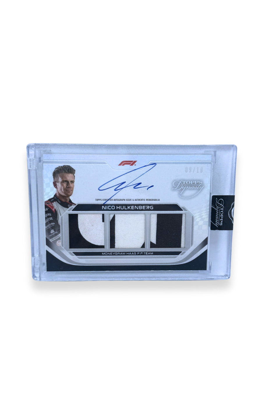 Front of 2024 Topps Dynasty Nico Hülkenberg Triple Patch Auto card, serial numbered 09/10, featuring black and white patches and on-card autograph