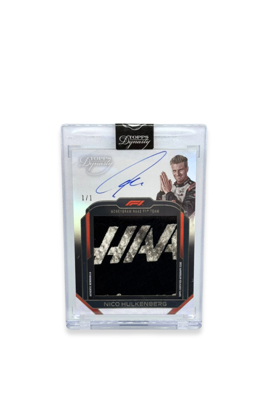 Front of 2024 Topps Dynasty Nico Hülkenberg logo patch autograph card, serial numbered 1 of 1, featuring silver and black Haas logo memorabilia.