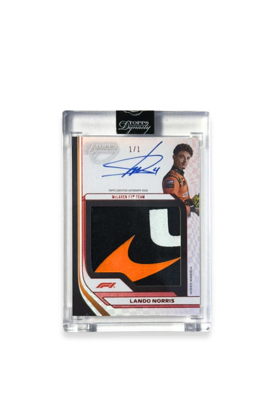 Front of 2024 Topps Dynasty Lando Norris logo patch autograph card, serial numbered 1 of 1, with orange, black, and white McLaren logo memorabilia patch
