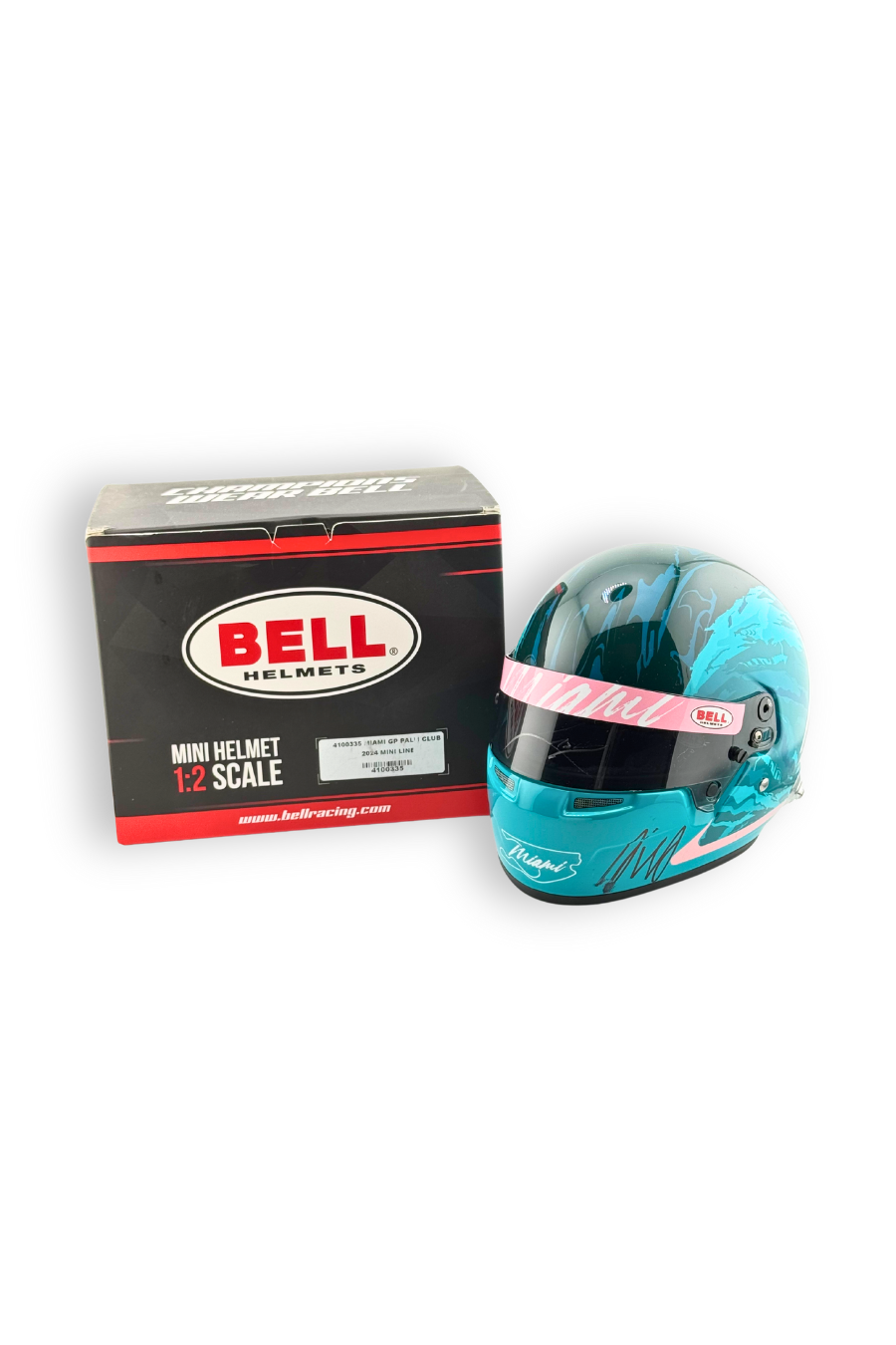 2024 Miami GP Paddock Club exclusive Bell 1:2 scale mini helmet with display box, front view.