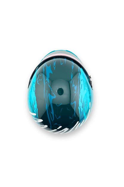 Top view of 2024 Miami GP Paddock Club Bell mini helmet, showing teal and dark wave pattern design.