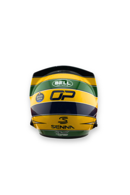Rear view of Oscar Piastri tribute helmet showing OP initials, Bell Racing logo, and Ayrton Senna tribute markings.