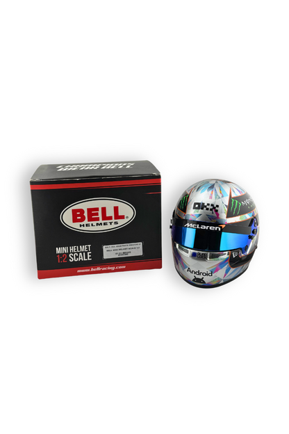 Oscar Piastri 2024 Singapore GP 1:2 scale Bell helmet displayed with Bell helmet box packaging.